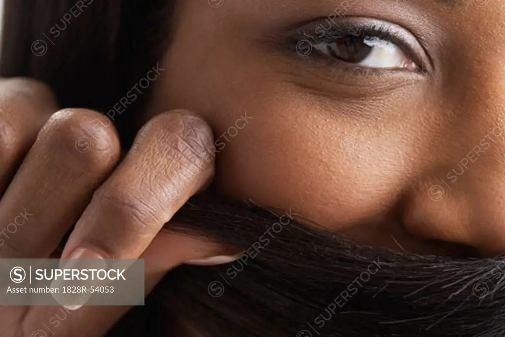 Woman Covering Face with Hair   