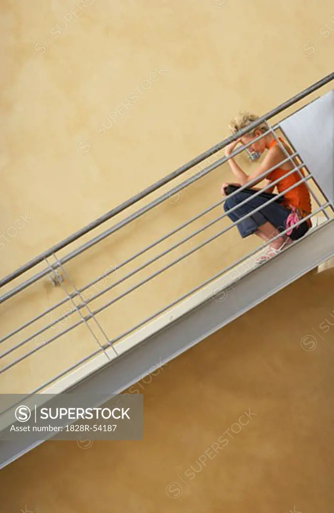 Woman Sitting on Stairs   