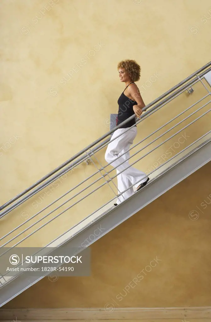 Woman Walking Down Stairs   