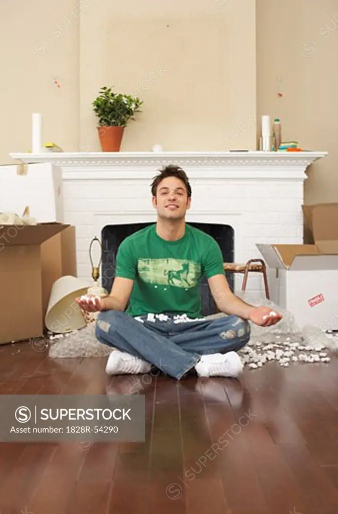 Man Meditating in New Home   