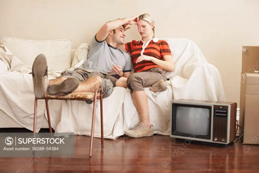Couple Sitting on Couch   