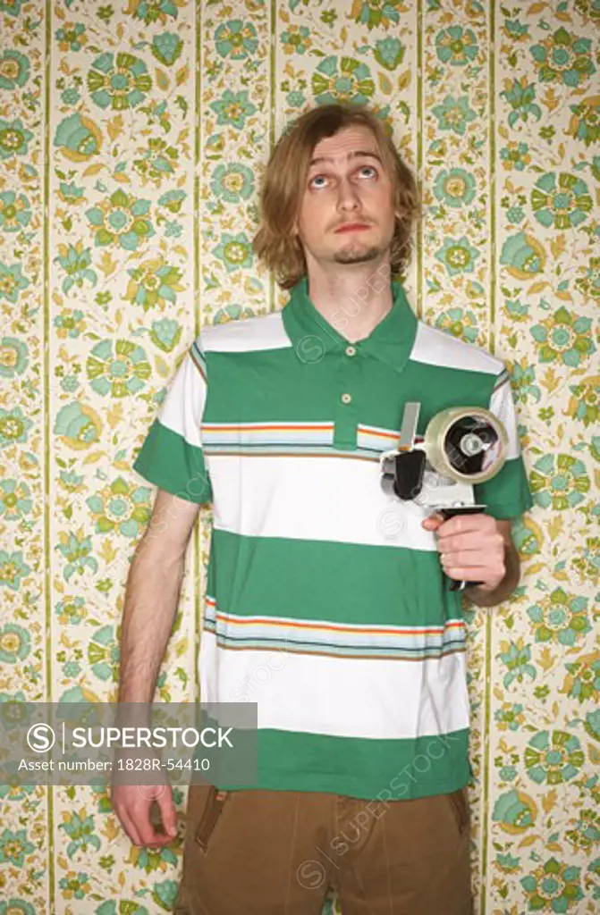 Portrait of Man Holding Tape Gun   