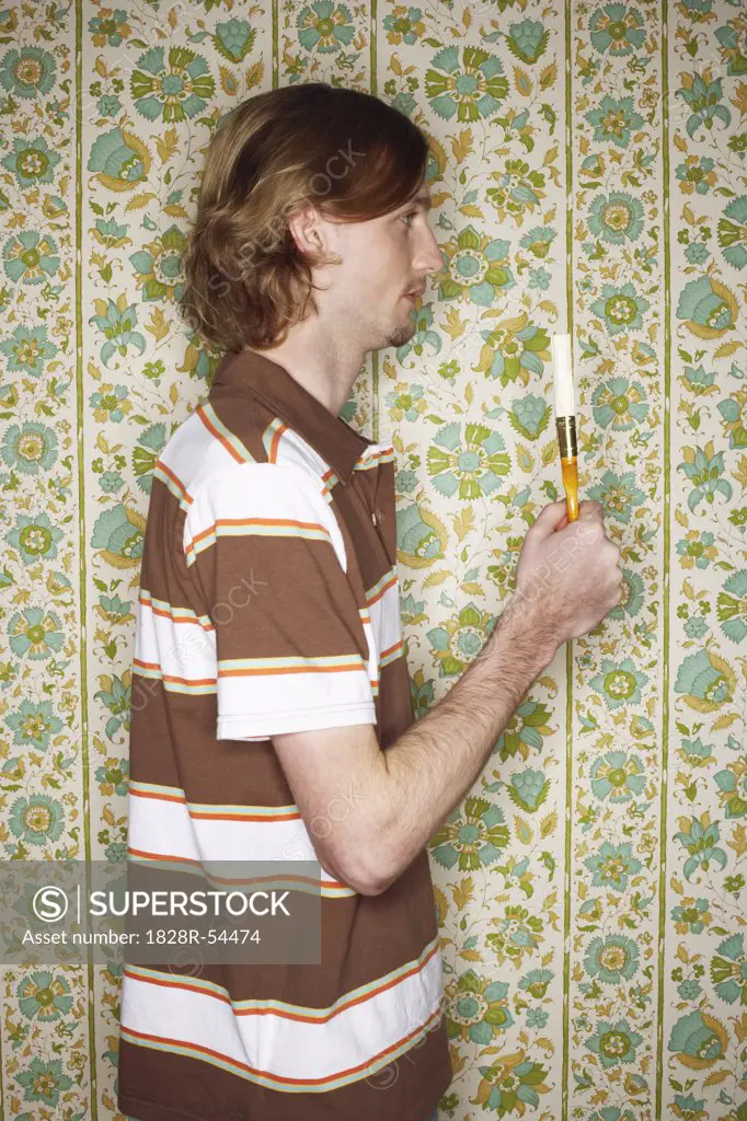 Man Holding a Paint Brush   