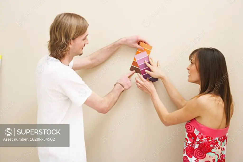 Couple Looking at Paint Samples   