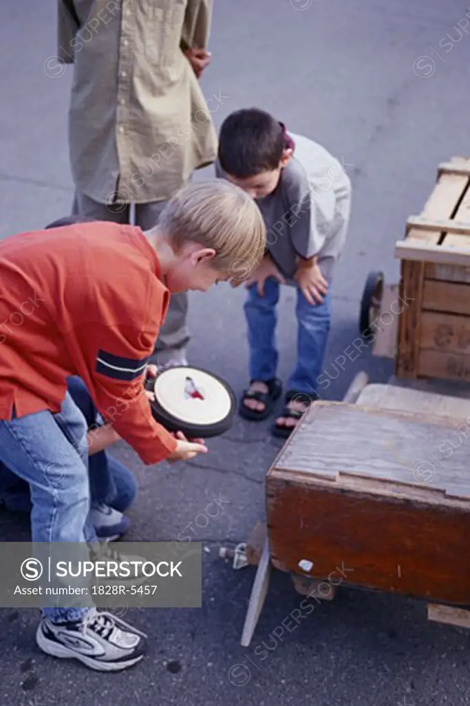 Group of Children Building Soapbox Car   