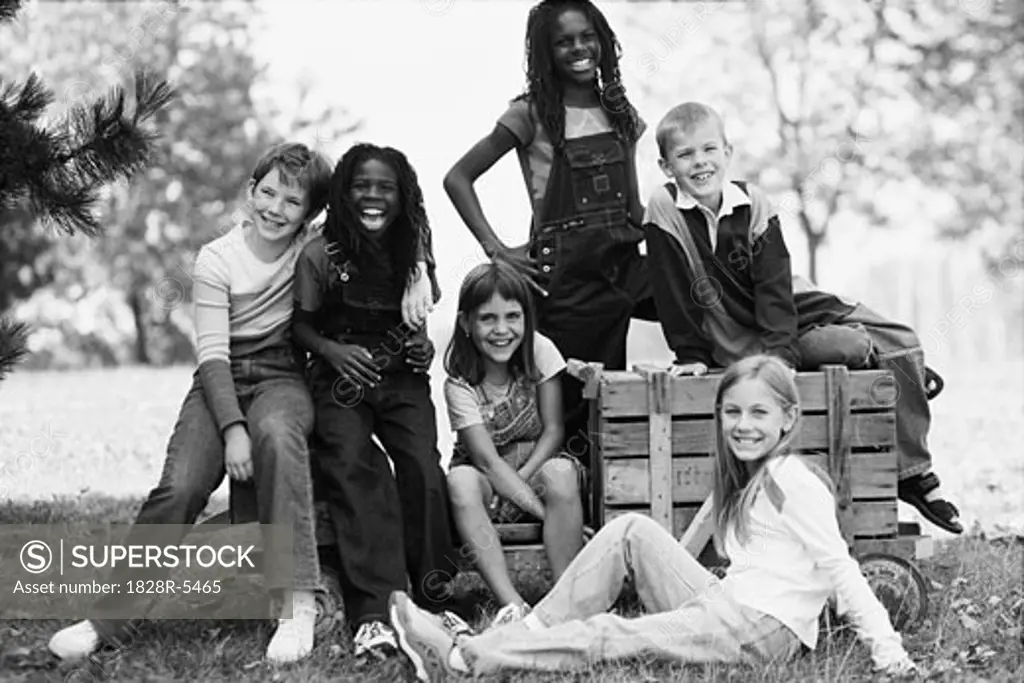 Group Portrait of Children with Soapbox Car Outdoors   