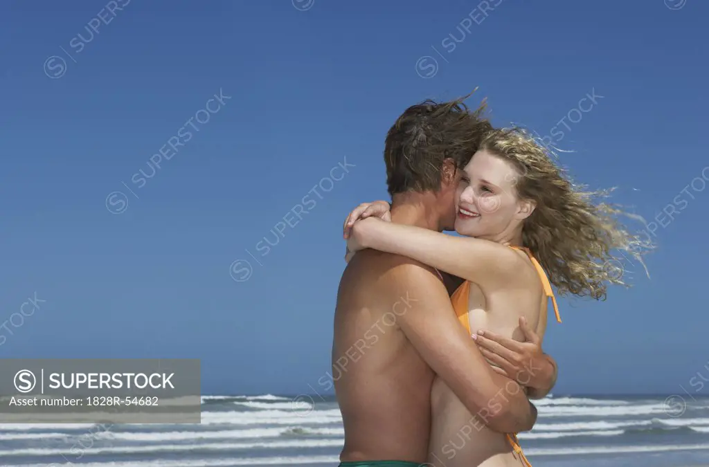 Young Couple On The Beach   