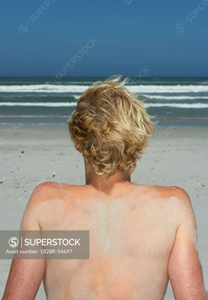 Young Man On The Beach   