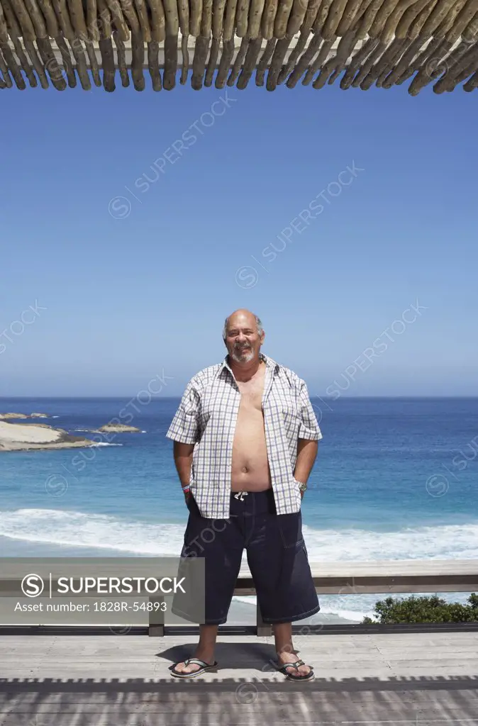 Man Standing by the Beach   