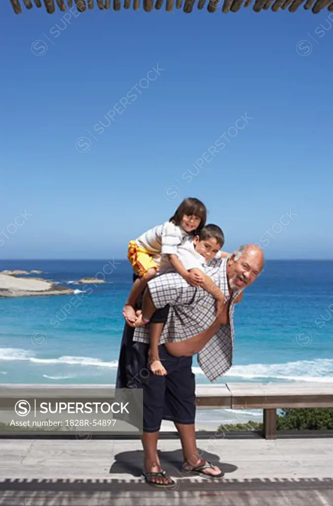 Portrait of Grandfather and Grandsons at the Beach   