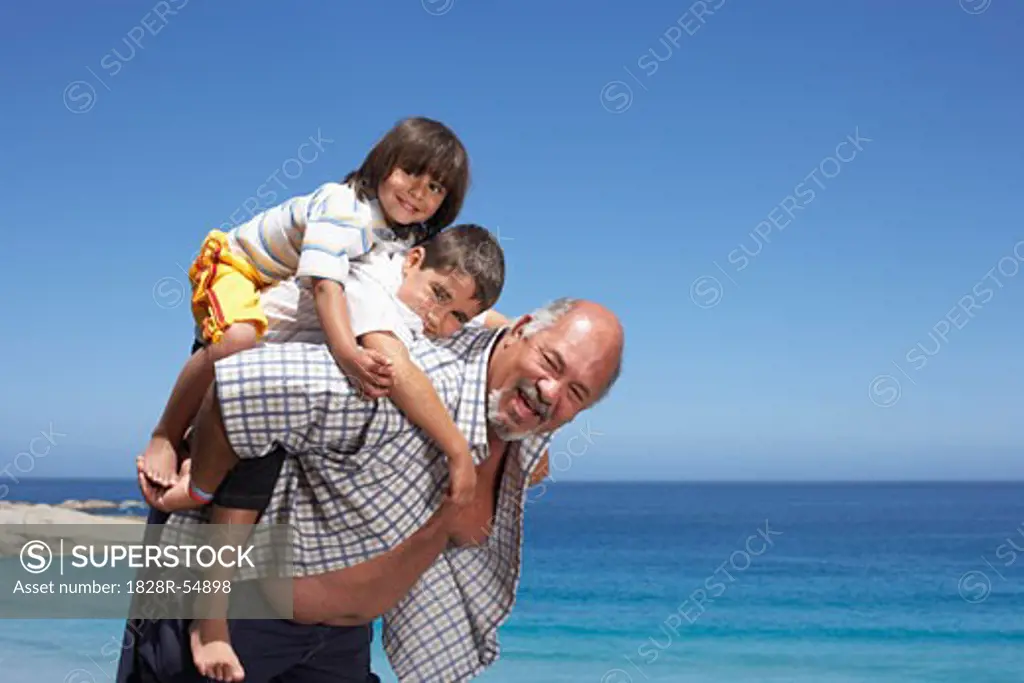 Portrait of Grandfather and Grandsons at the Beach   