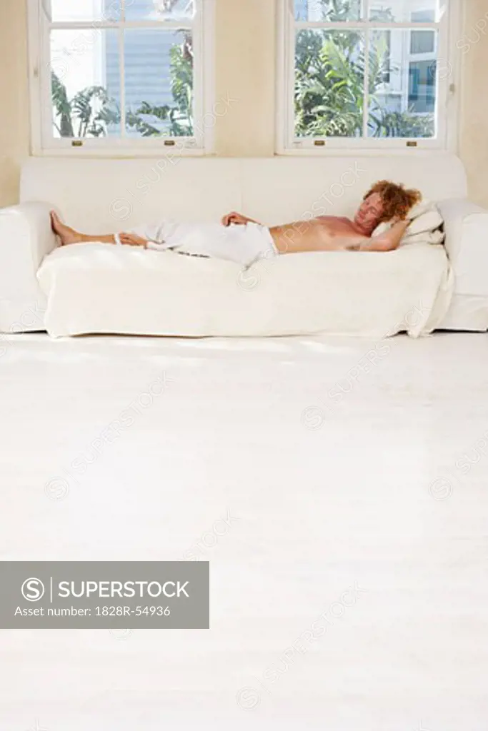 Man Sleeping on Sofa   