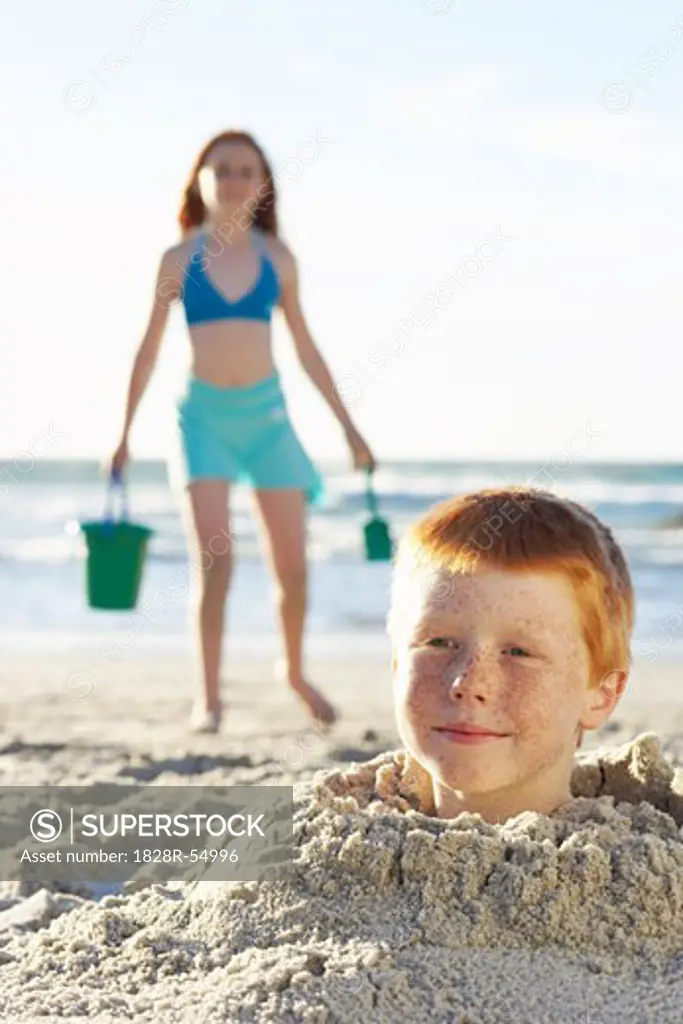 Boy Buried in Sand   