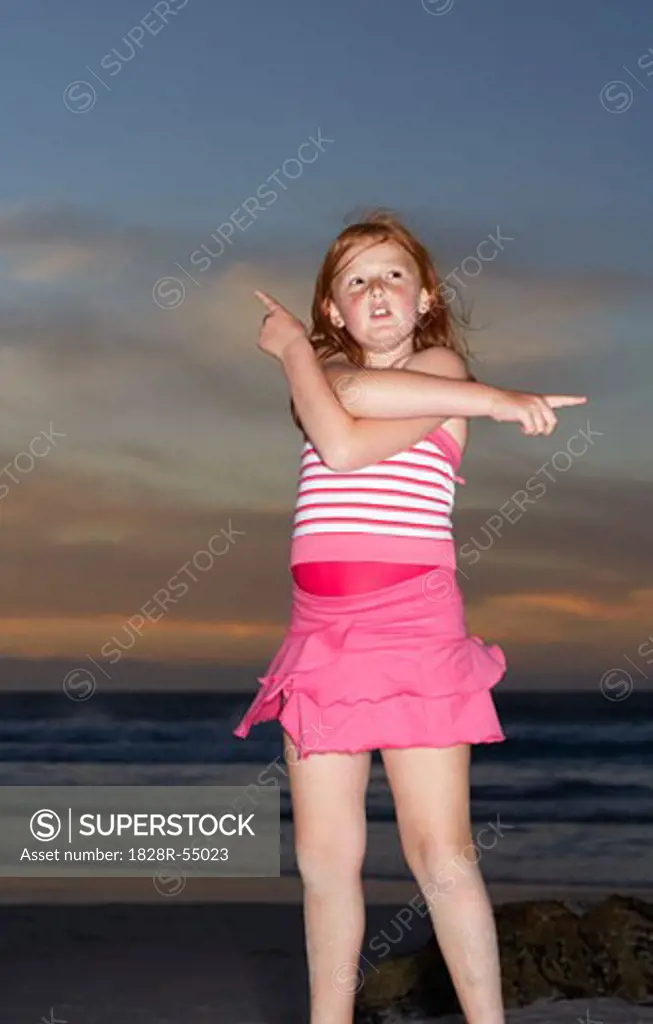 Girl on the Beach, Pointing In Different Directions   