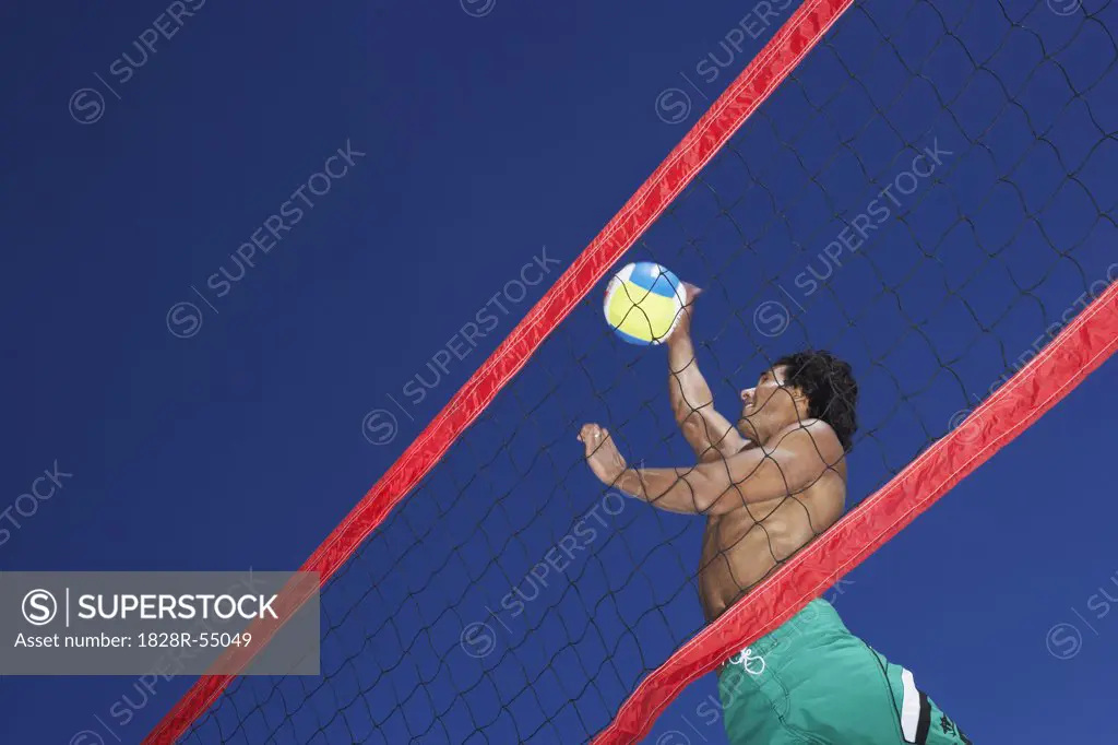 Man Playing Beach Volleyball   