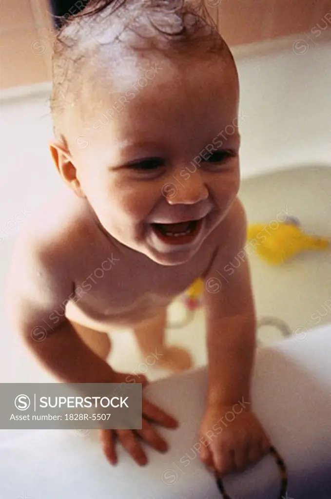 Baby Standing in Bathtub   