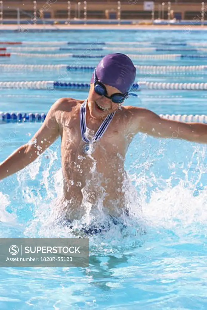 Boy Cheering in Swimming Pool   