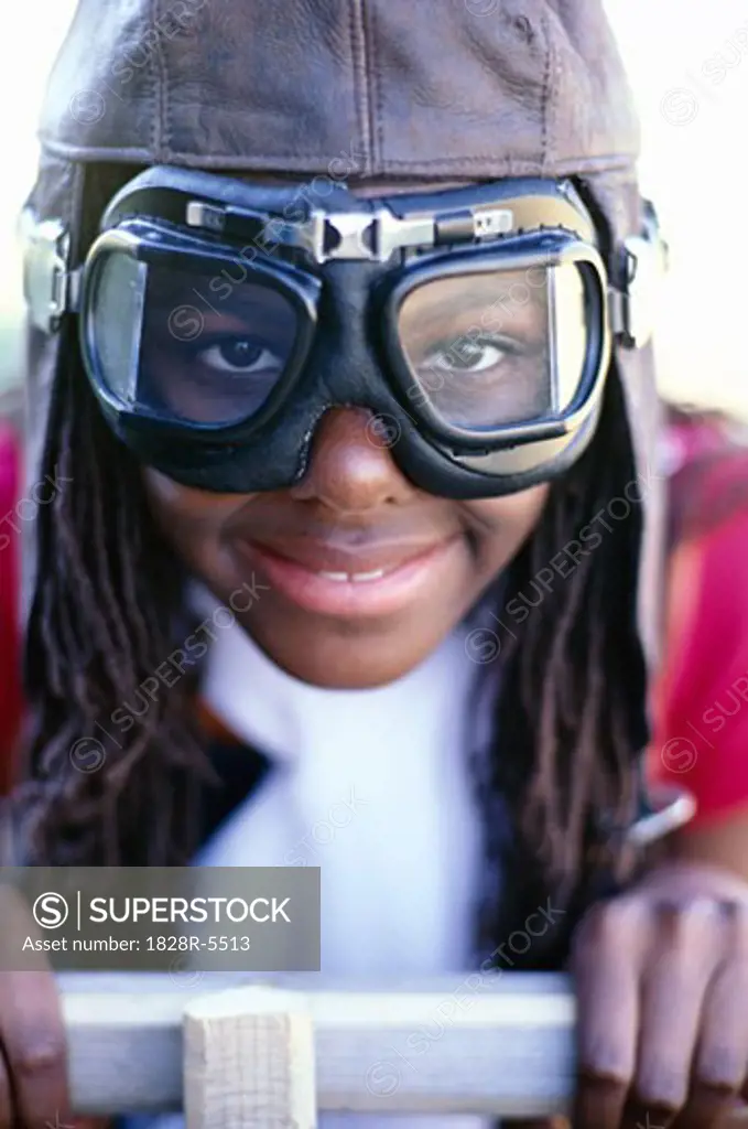 Portrait of Girl Wearing Goggles Sitting in Soapbox Car   