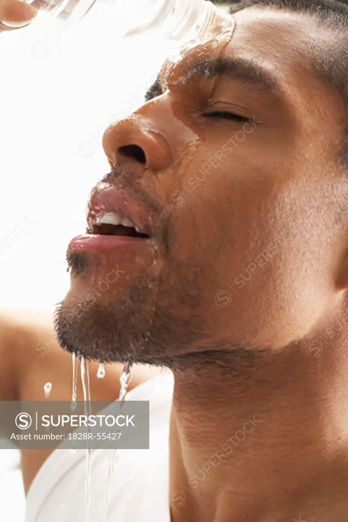Man Pouring Water on Face   