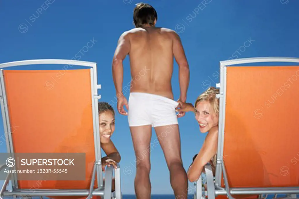 Women and Man At Poolside   