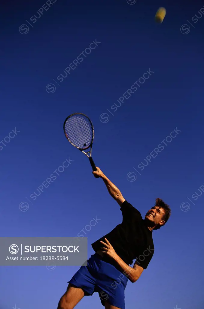 Man Playing Tennis   