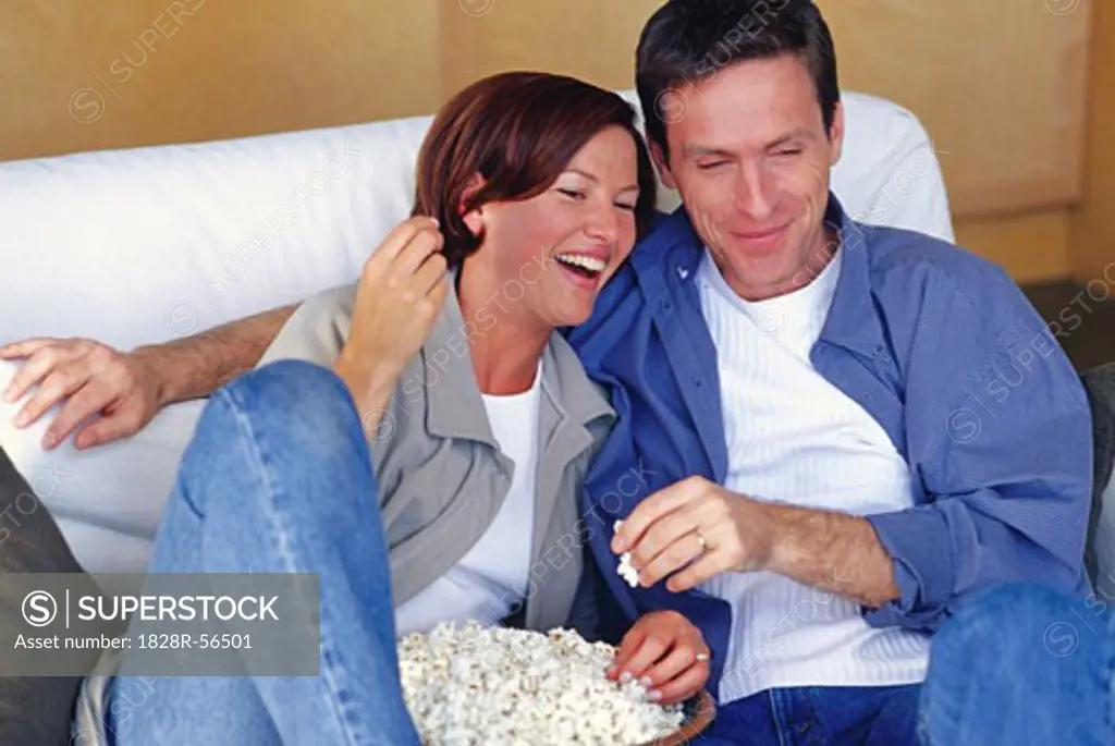 Couple Sitting On Couch   