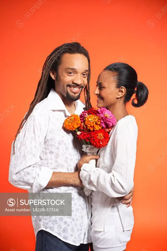 Portrait of Couple With Flowers   