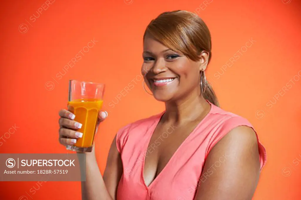 Woman Drinking Carrot Juice   