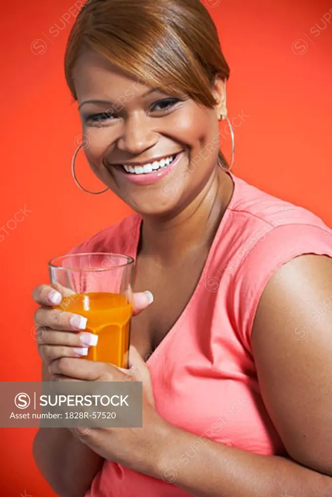 Woman Drinking Carrot Juice   