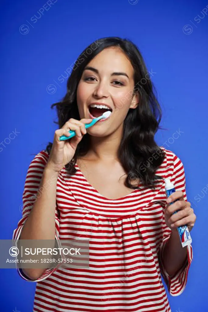 Woman Brushing her Teeth   