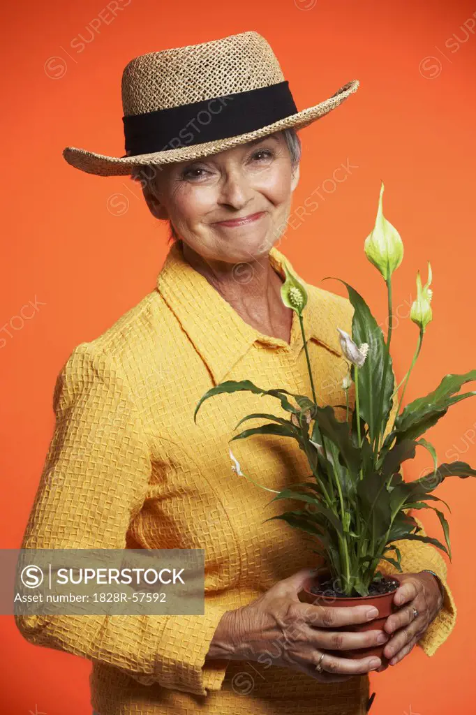 Portrait of Woman Holding Plant   