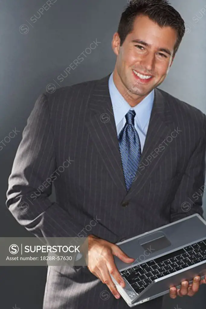 Businessman with Laptop Computer   