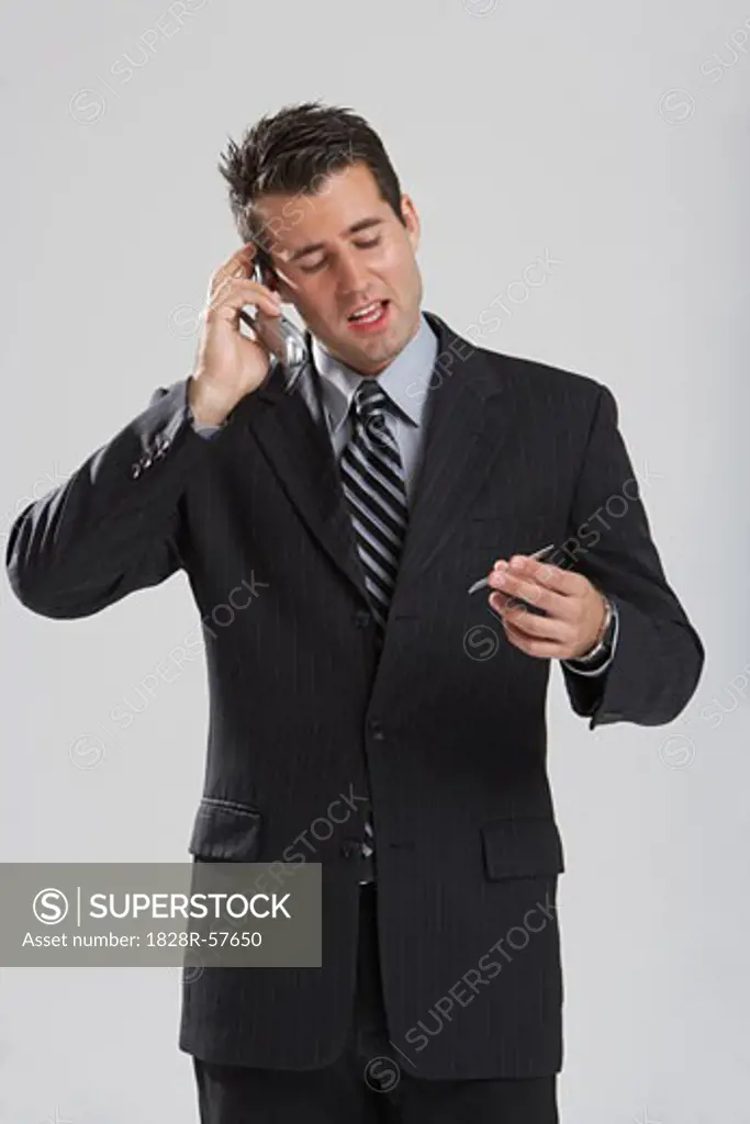 Man with Credit Card and Cellular Phone   