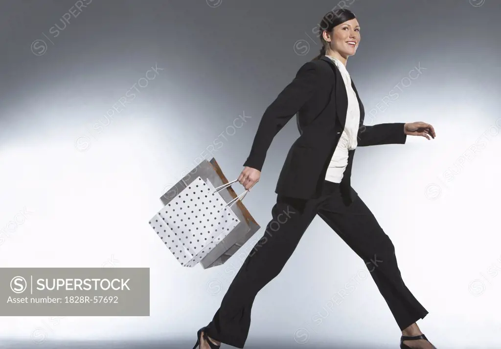 Woman Carrying Shopping Bags   