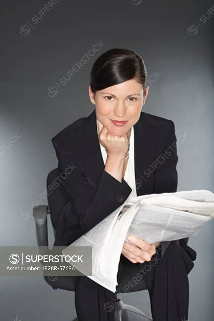 Businesswoman Reading Newspaper   