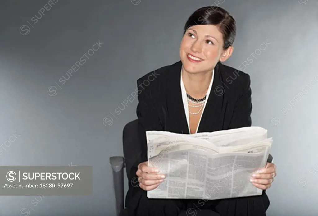 Businesswoman Reading Newspaper   