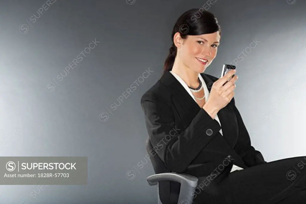 Businesswoman Holding Cell Phone   