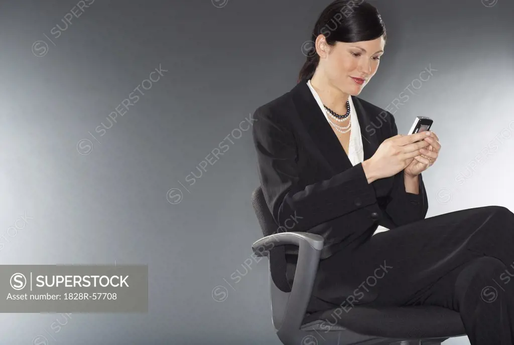 Businesswoman Sending Text Message   