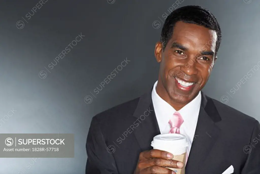 Businessman Holding a Cup of Coffee   