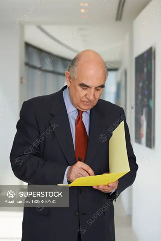 Businessman with File Folder   