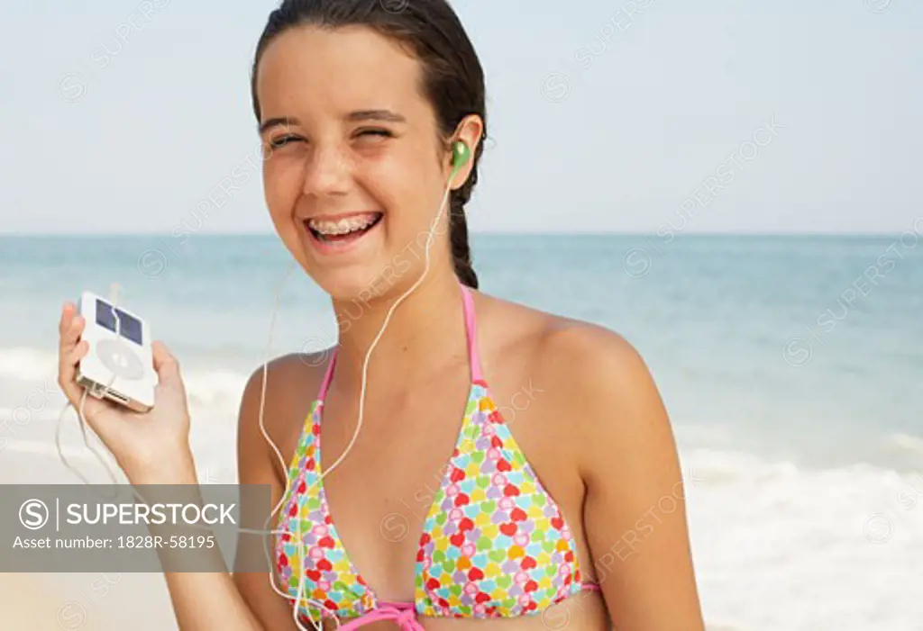 Girl on Beach With Mp3 Player   