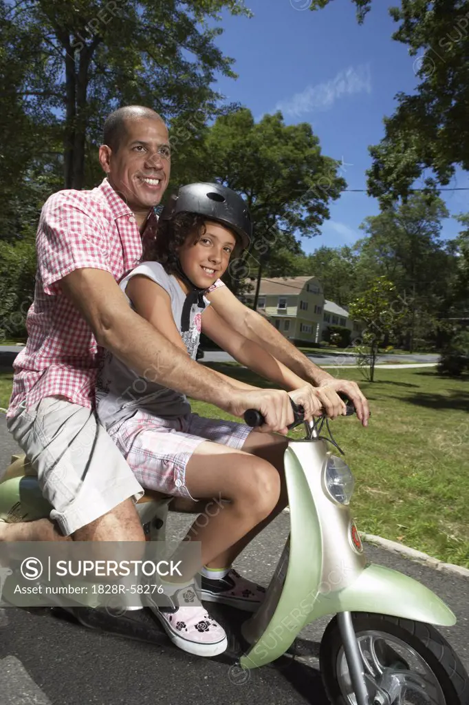 Father and Daughter Riding Scooter   