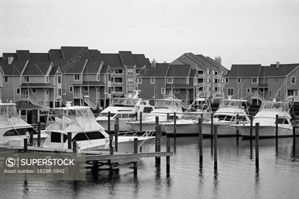 Boats in Harbor near Houses, Cape Hatteras, North Carolina, USA   