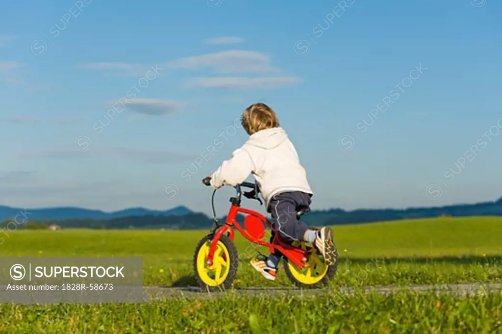 Little Boy Riding His Bike, Hof bei Salzburg, Salzburger Land, Austria