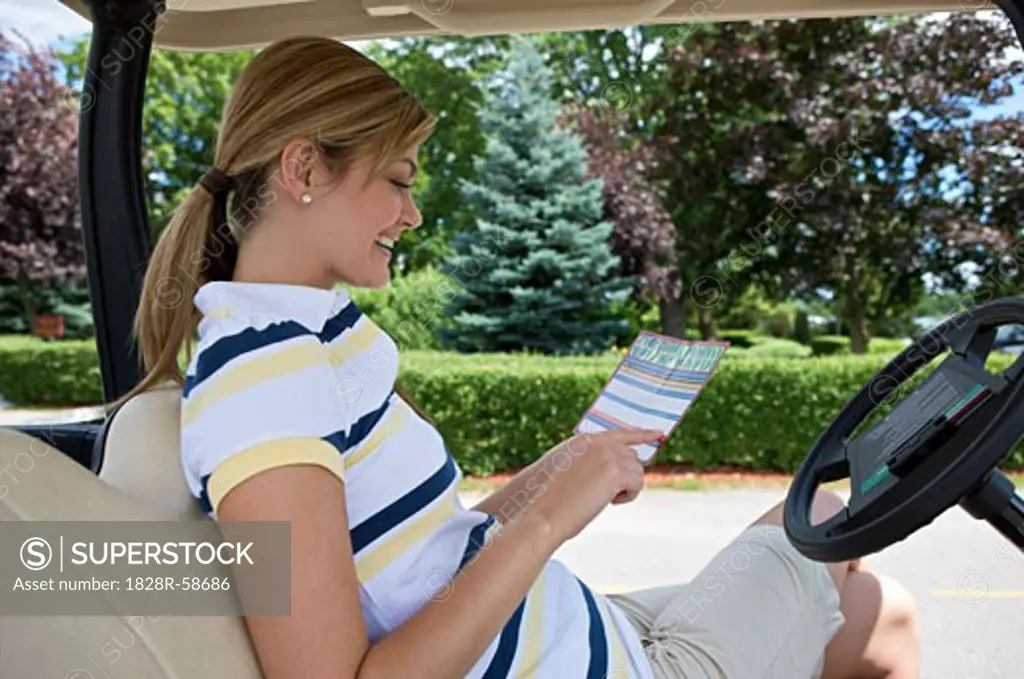Woman with Score Card in Golf Cart, Burlington, Ontario, Canada   