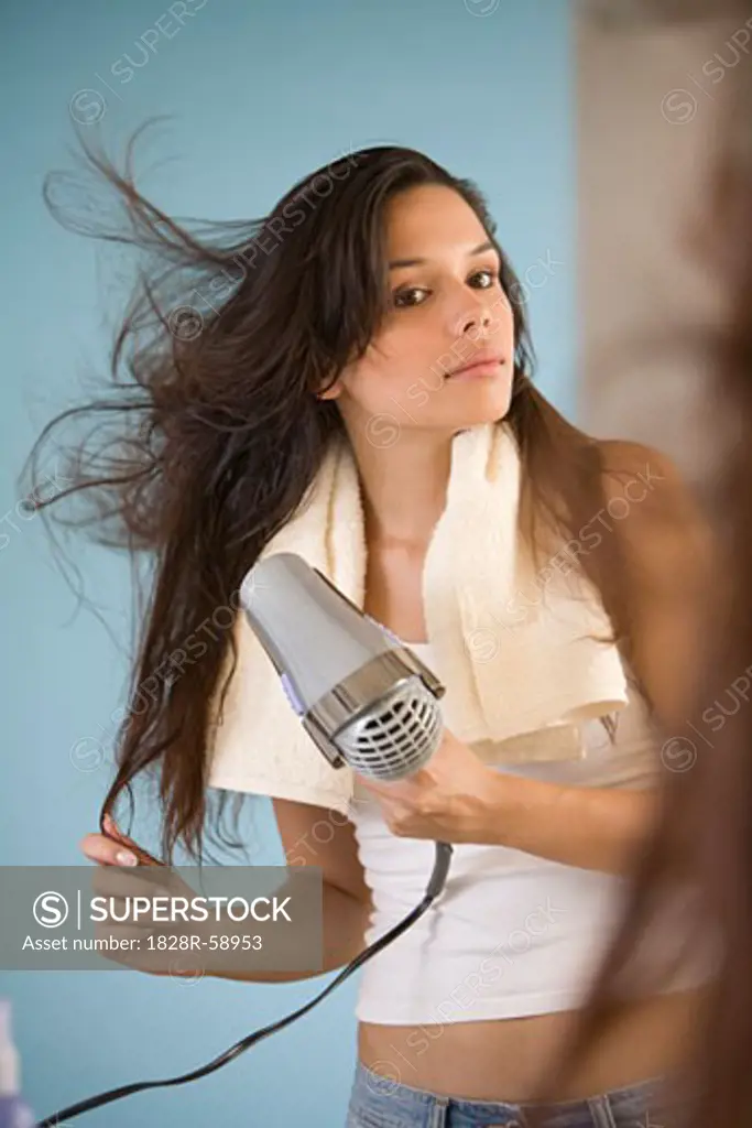 Woman Blow Drying Her Hair   