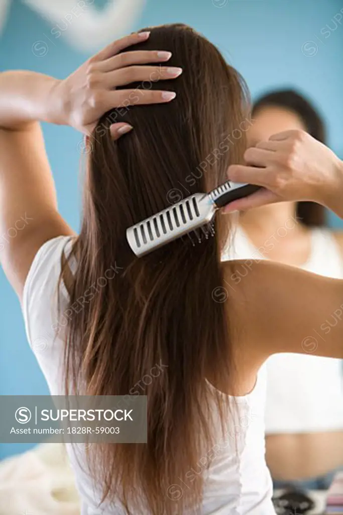 Woman Brushing Her Hair   