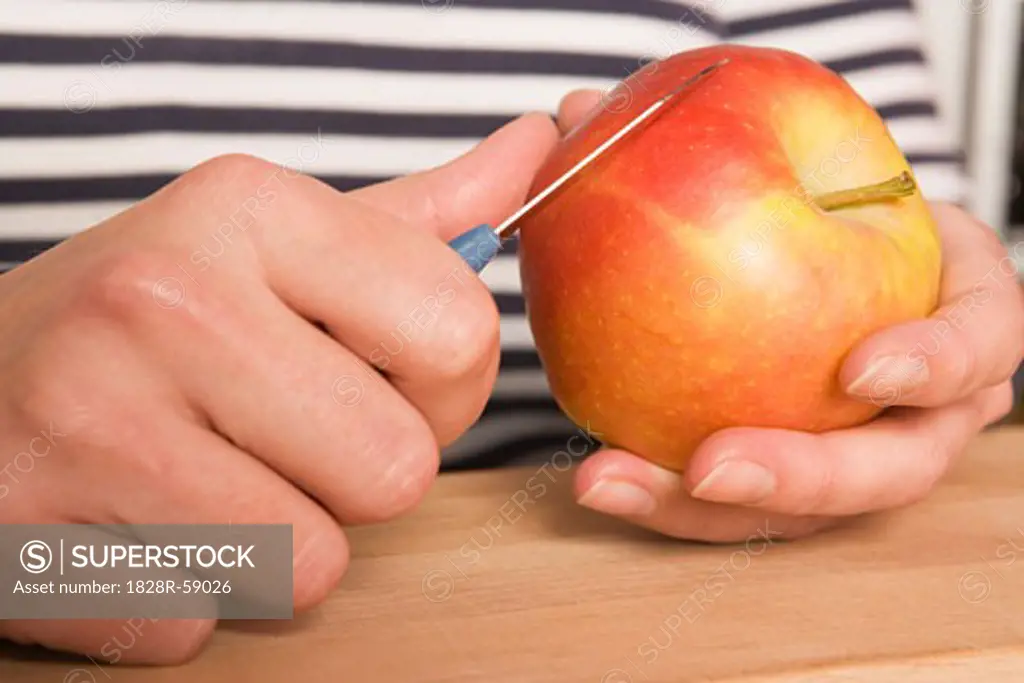 Hands Slicing Apple