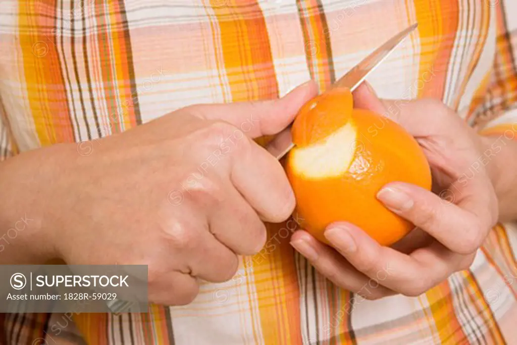 Hands Peeling Orange