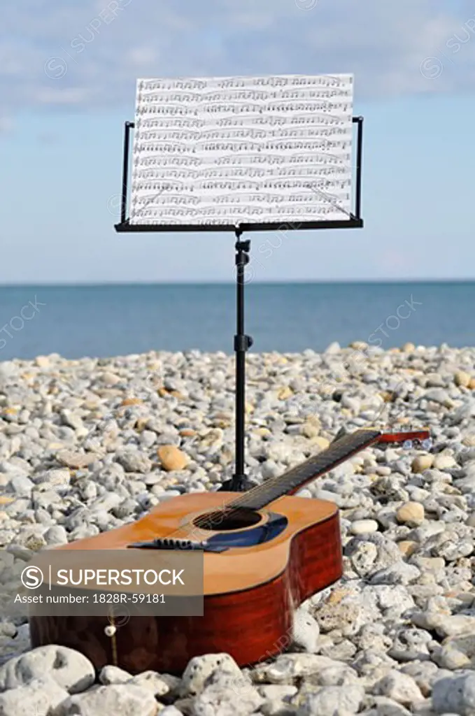 Music Stand and Guitar on Beach   